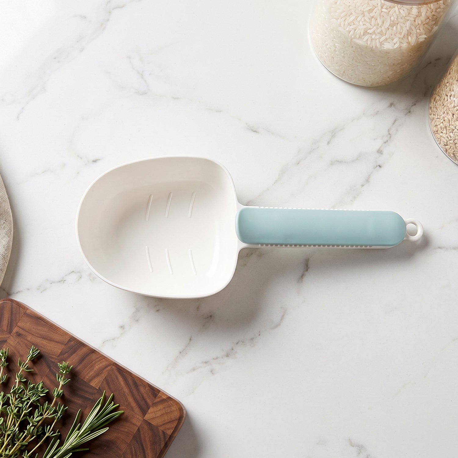 The large capacity plastic scoop ready for measuring rice or grains.
