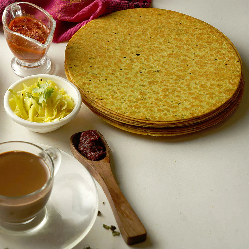 Close-up of Methi Khakhra showing fenugreek leaves and texture.