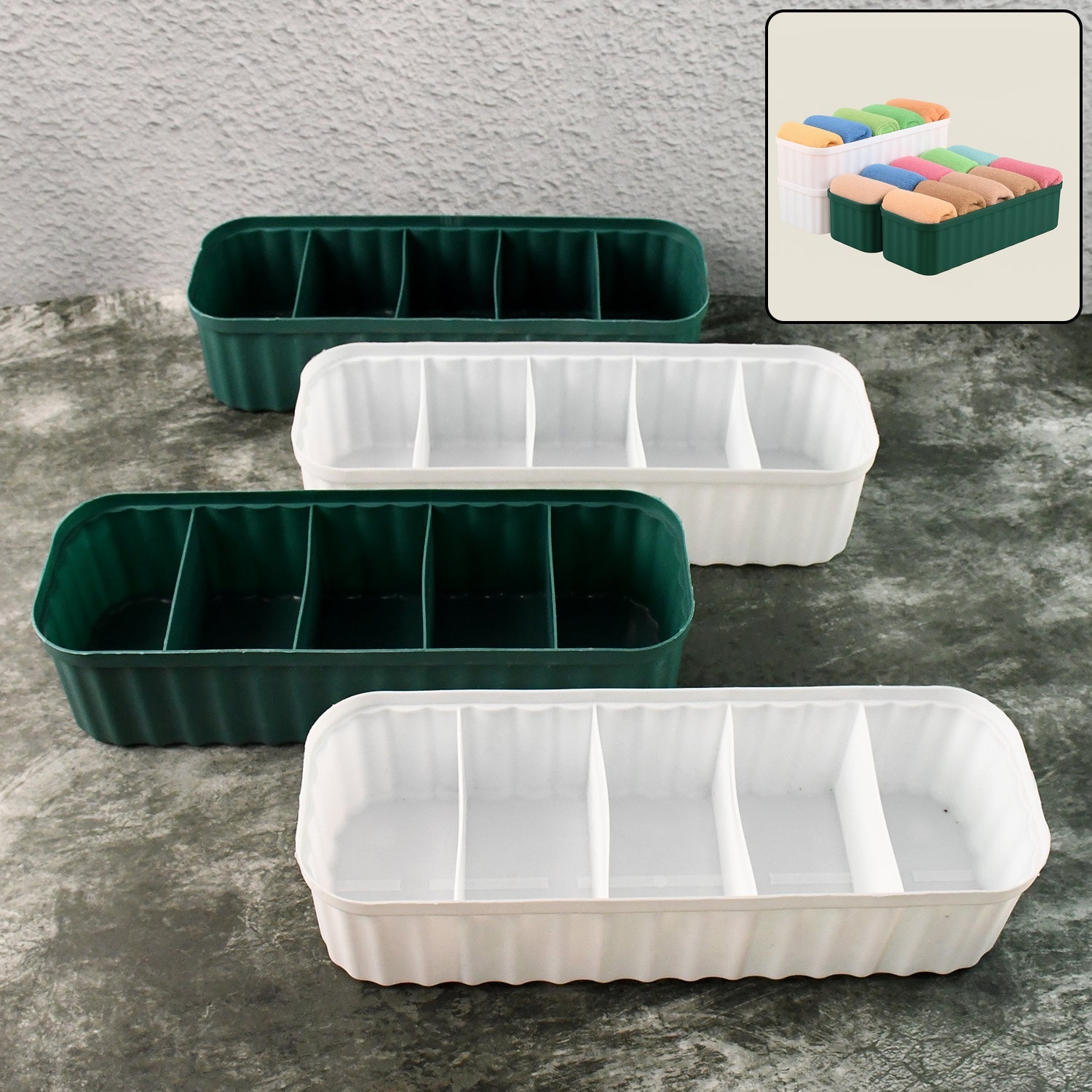 Four 5-compartment drawer organizers neatly stacked, storing socks and underwear.