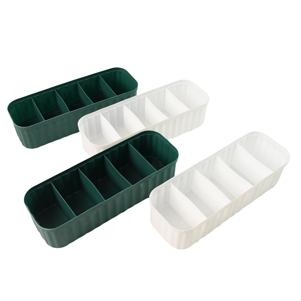 Set of four empty 5-compartment drawer organizers ready for use.