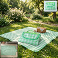 Foldable picnic mat with handle, ideal for outdoor camping and beach trips