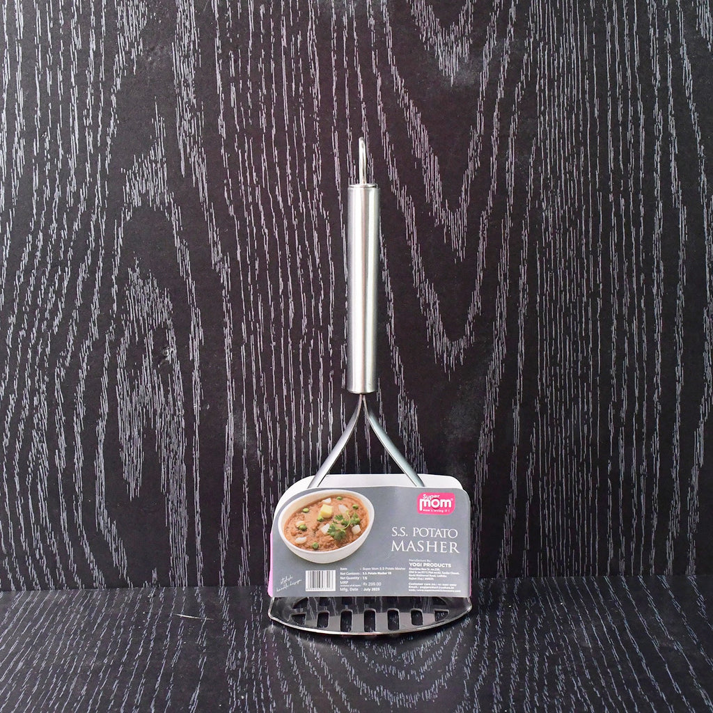 Potato masher in kitchen environment with ergonomic handle