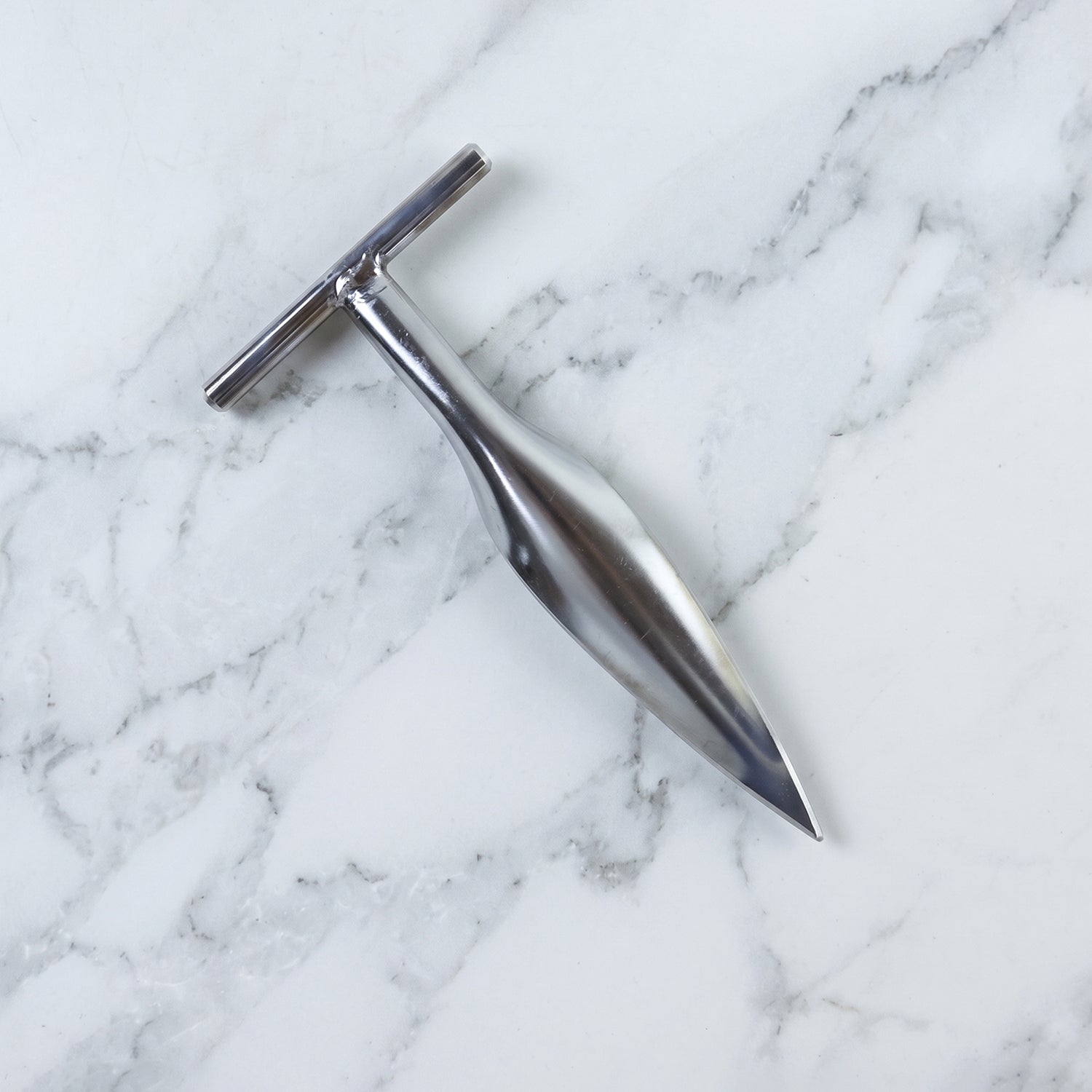 Stainless steel coconut breaker tool set displayed on a white background
