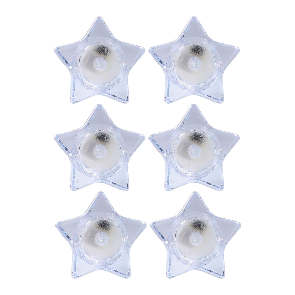 Battery operated LED candles in star-shaped holders for safe lighting