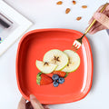 Durable food-grade plastic square quarter plates, a set of six.