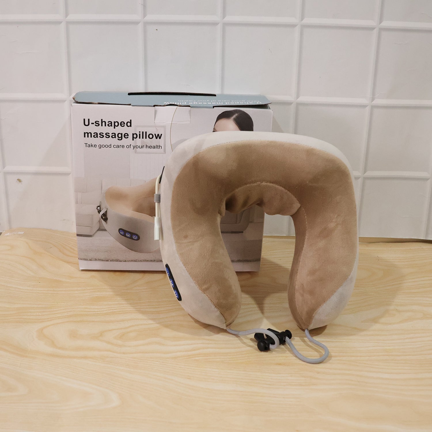 Person using the neck massage pillow for relaxation