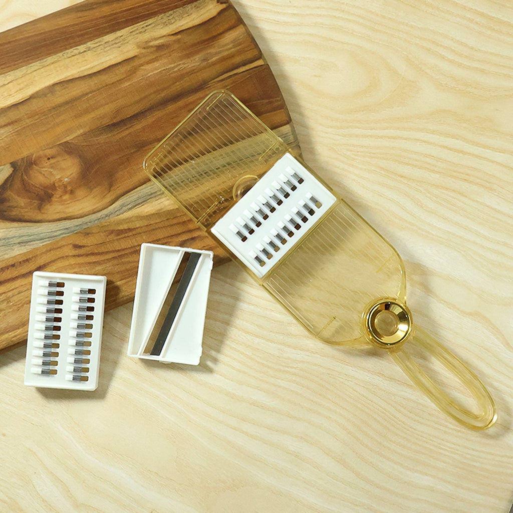 Kitchen tool for grating and slicing vegetables easily