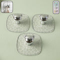 Strong clear adhesive wall hook holding keys and bags on a white wall.