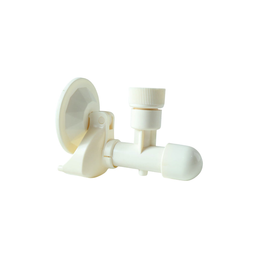 White plastic soap dispenser mounted on bathroom wall with suction cup