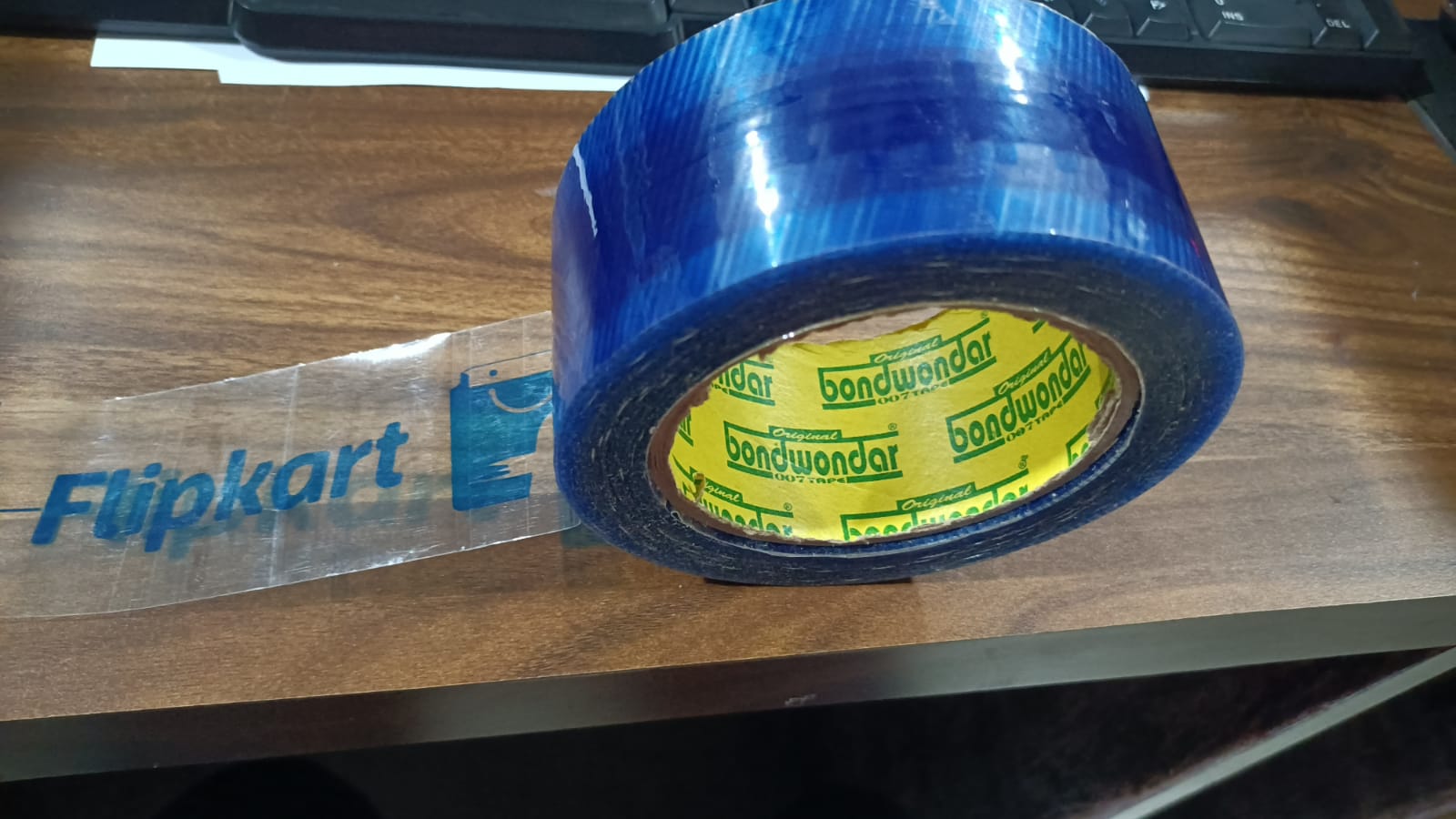 Multiple rolls of blue Flipkart packaging tape for various uses.