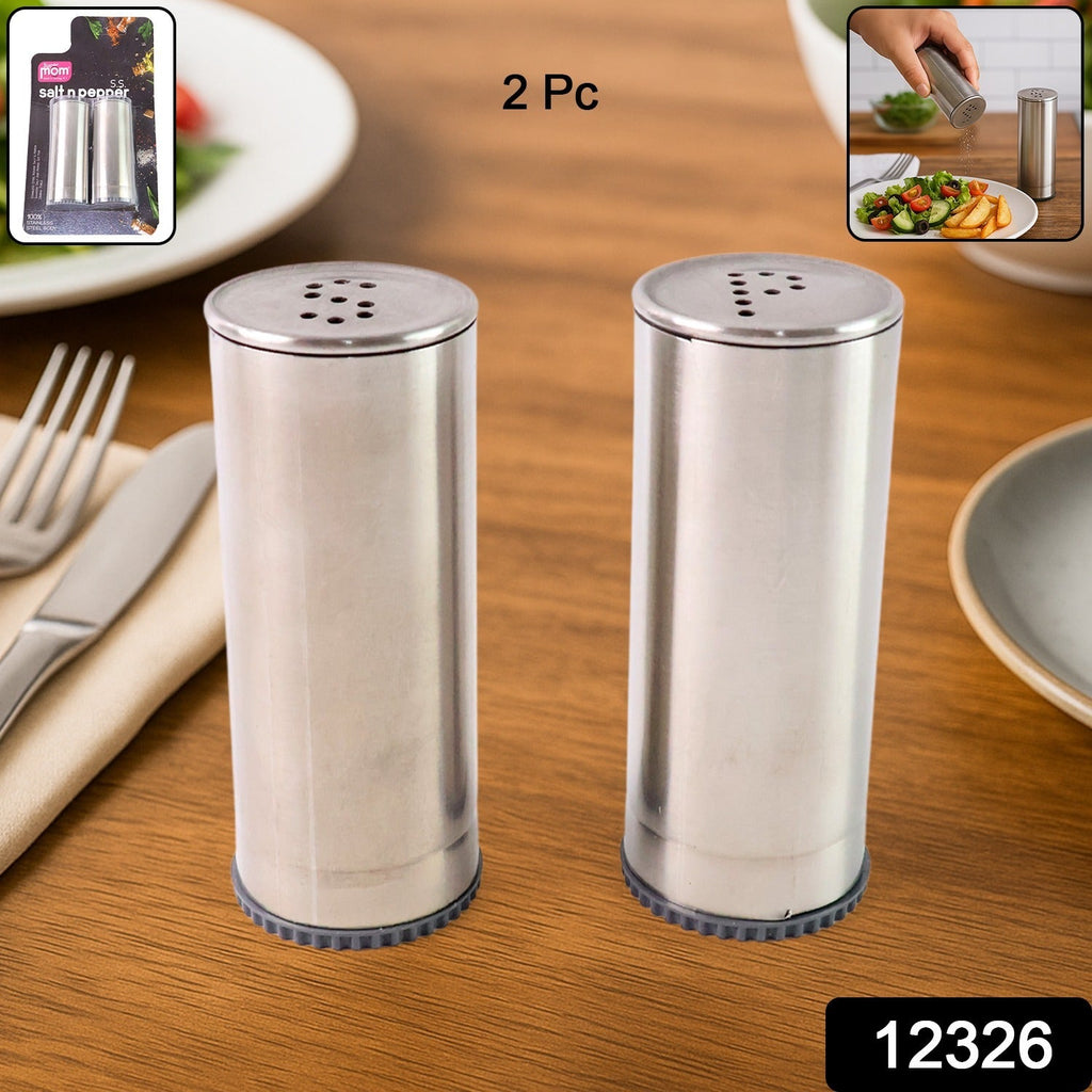 Classic stainless steel salt and pepper shakers arranged on dining table