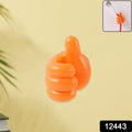 Bright orange palm snap silicone clip mounted on wall for keys