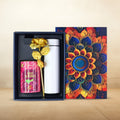 Rose almonds gift hamper with chocolate almonds, golden rose, and stainless steel bottle