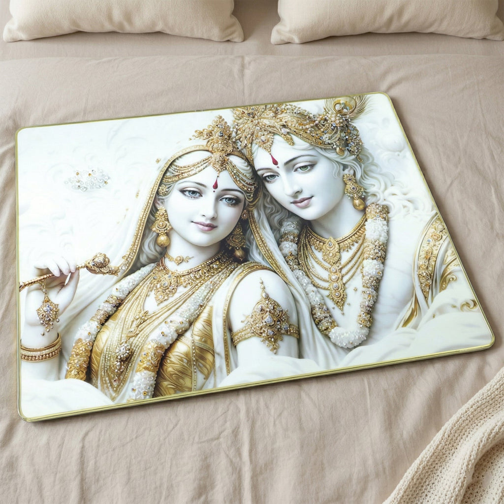 Close-up of intricate Radha Krishna artwork in white and gold