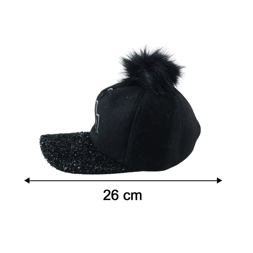 Side view of trendy winter baseball cap with pom pom