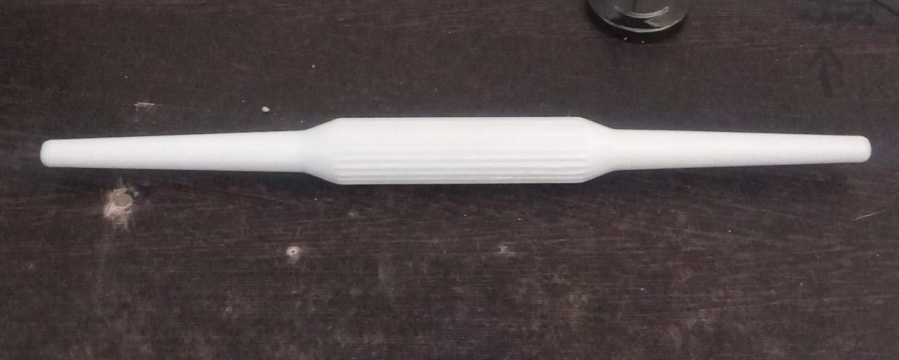 Sturdy plastic rolling pin with anti-skid base for stable operation.