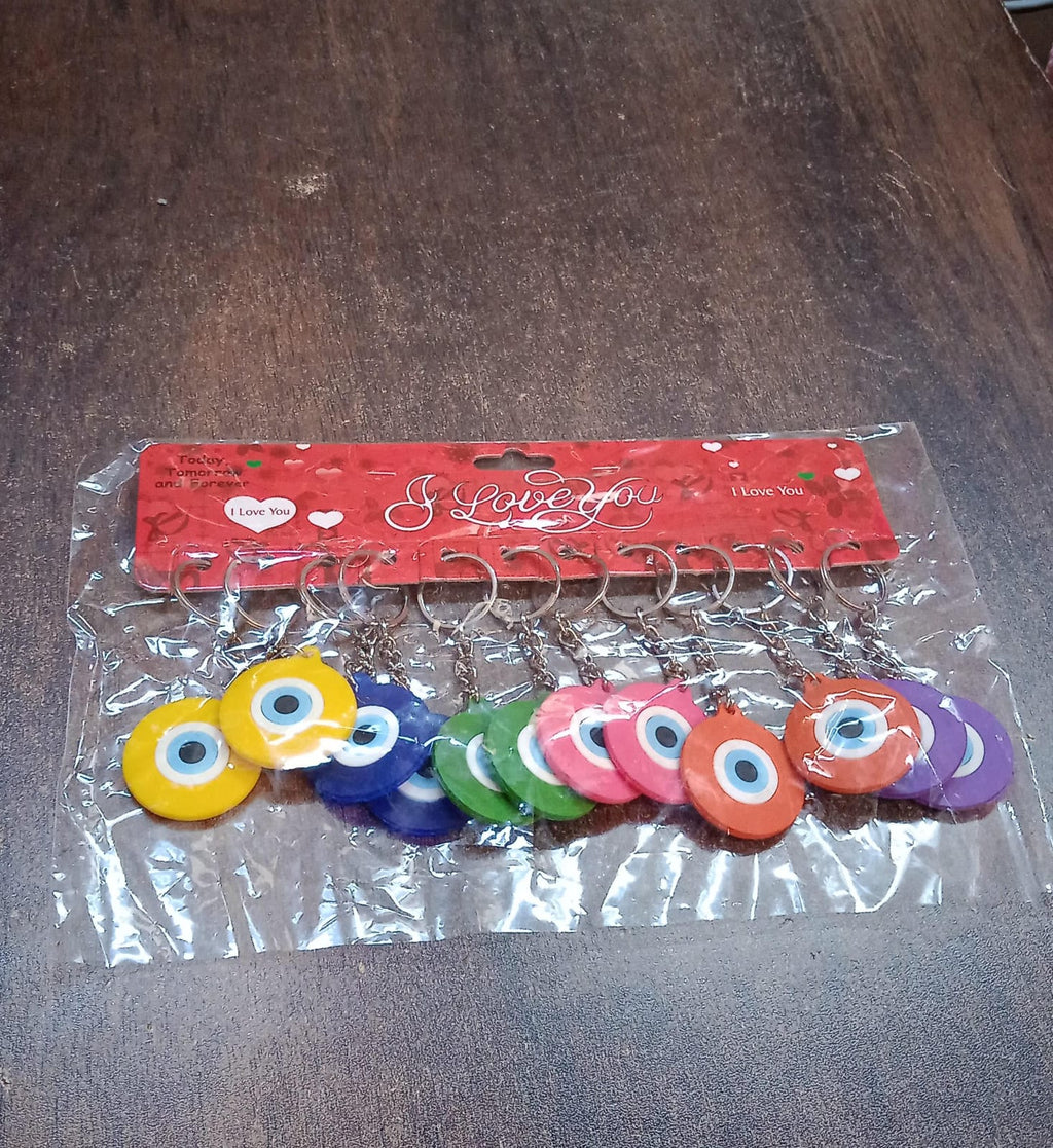 Assorted color evil eye silicone keychains laid out neatly