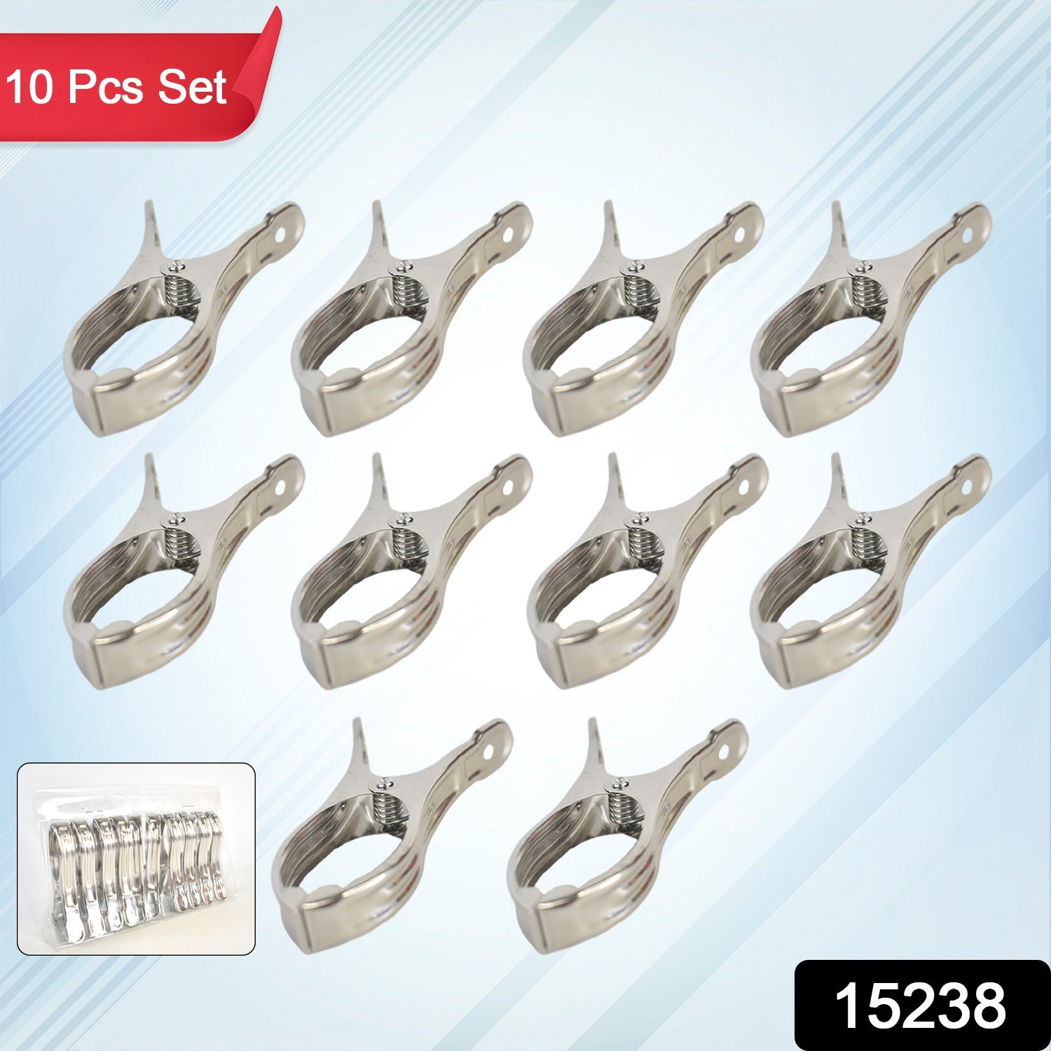 Close-up of stainless steel beach towel clip gripping fabric securely.