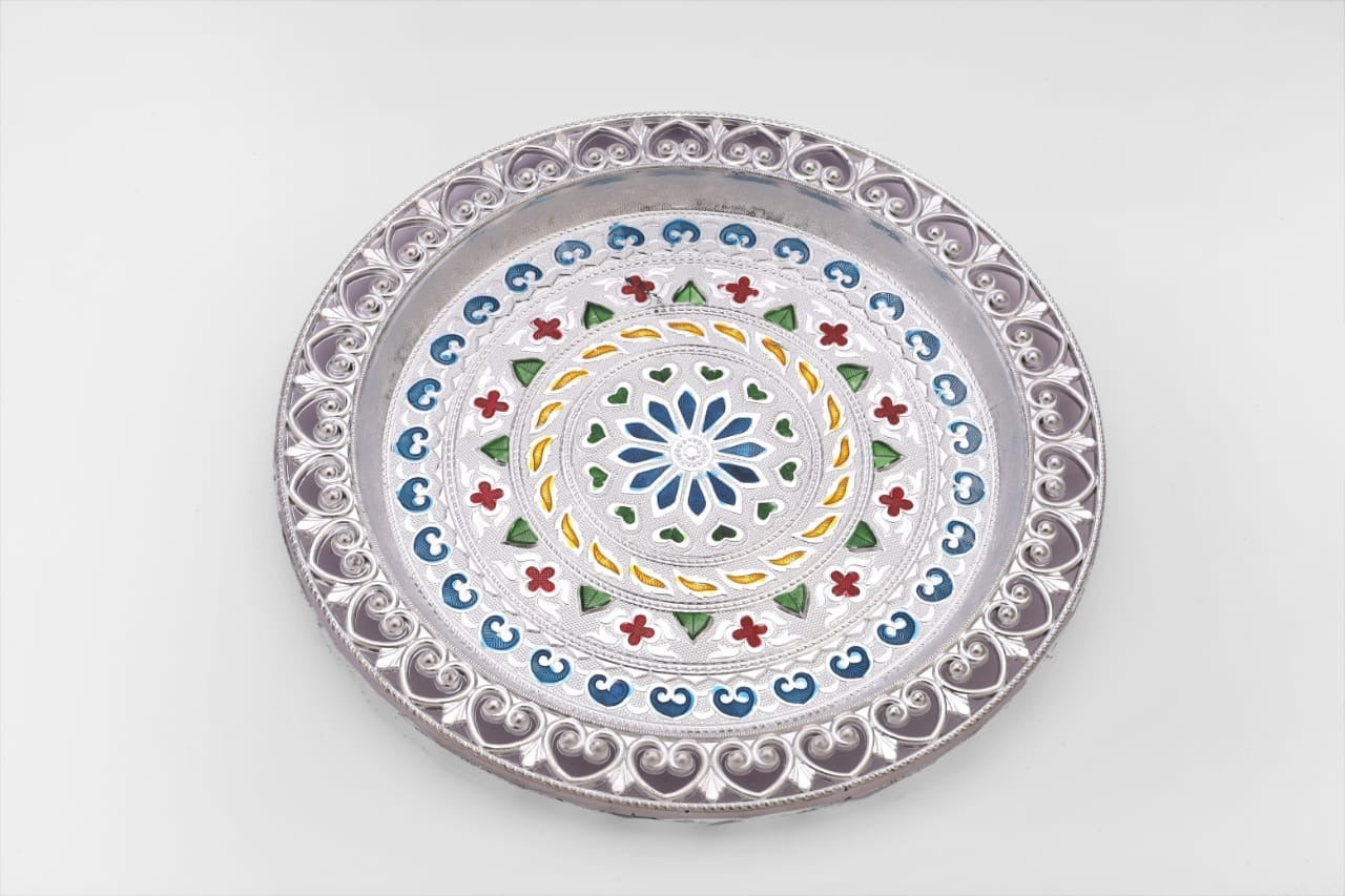 Decorative silver plated pooja thali with a polished finish, reflecting cultural heritage.