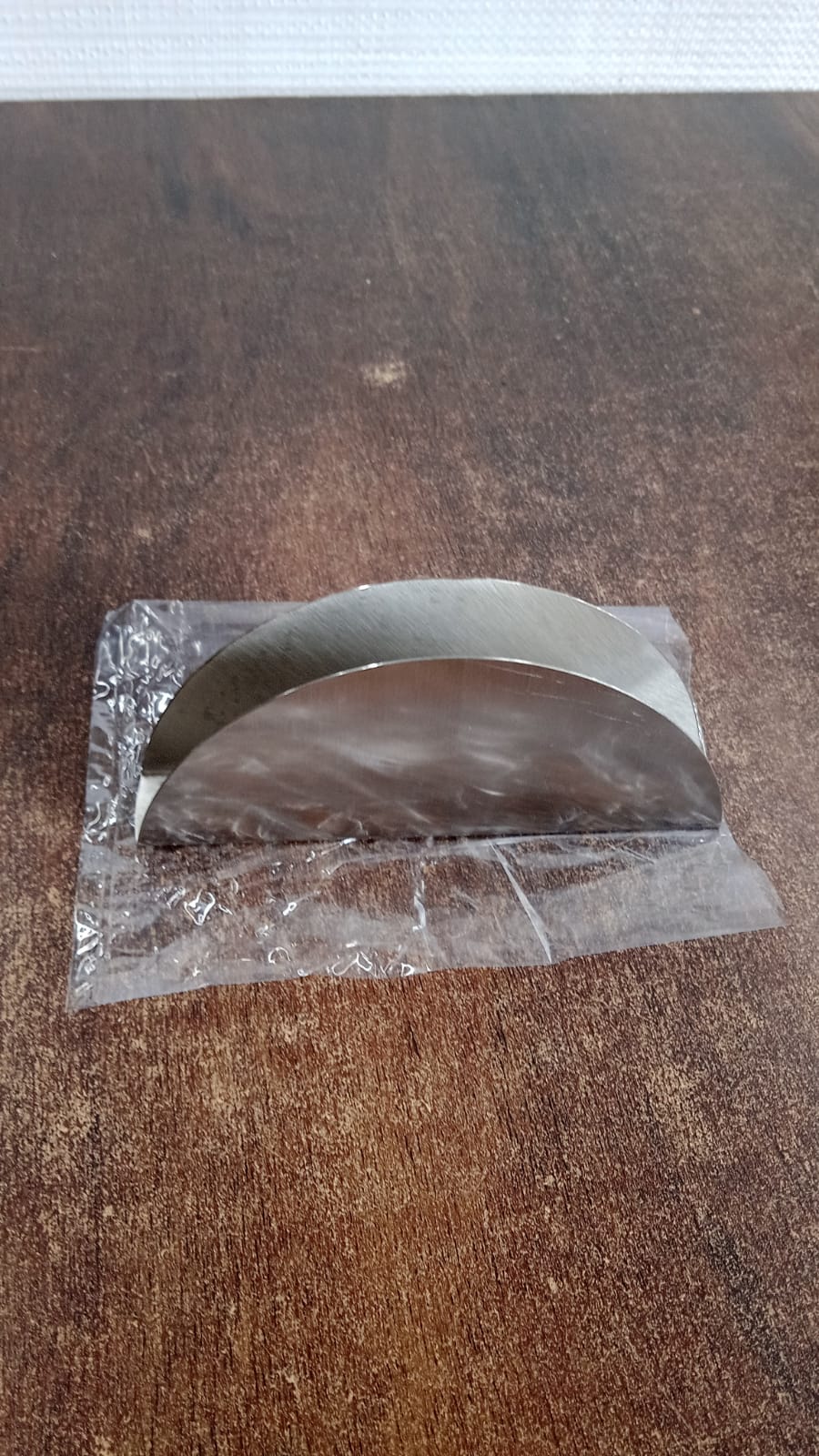 Stainless steel tissue napkin holder featuring modern design