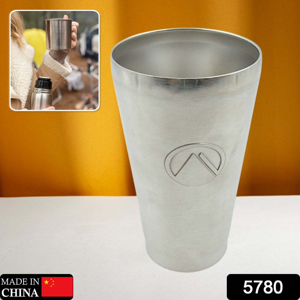 Close-up of the vacuum insulated travel mug's durable stainless steel finish.