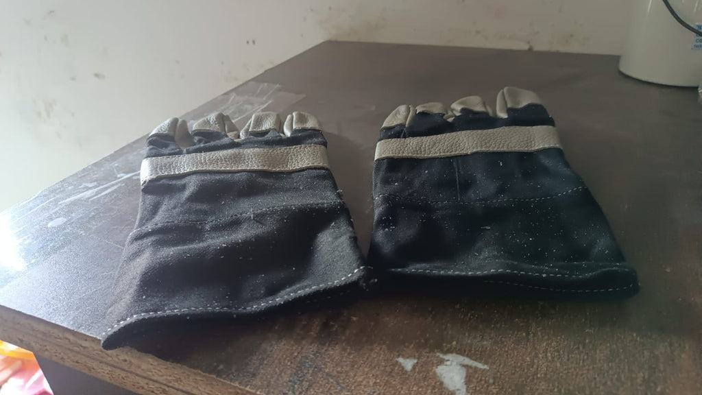 Person using BraveVault leather gloves for various outdoor tasks.