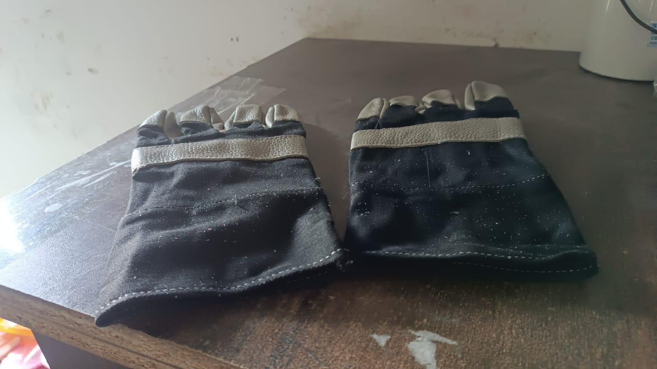 Person using BraveVault leather gloves for various outdoor tasks.