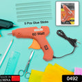 Close-up of the 60-watt hot melt glue gun showing the on/off switch and comfortable grip.