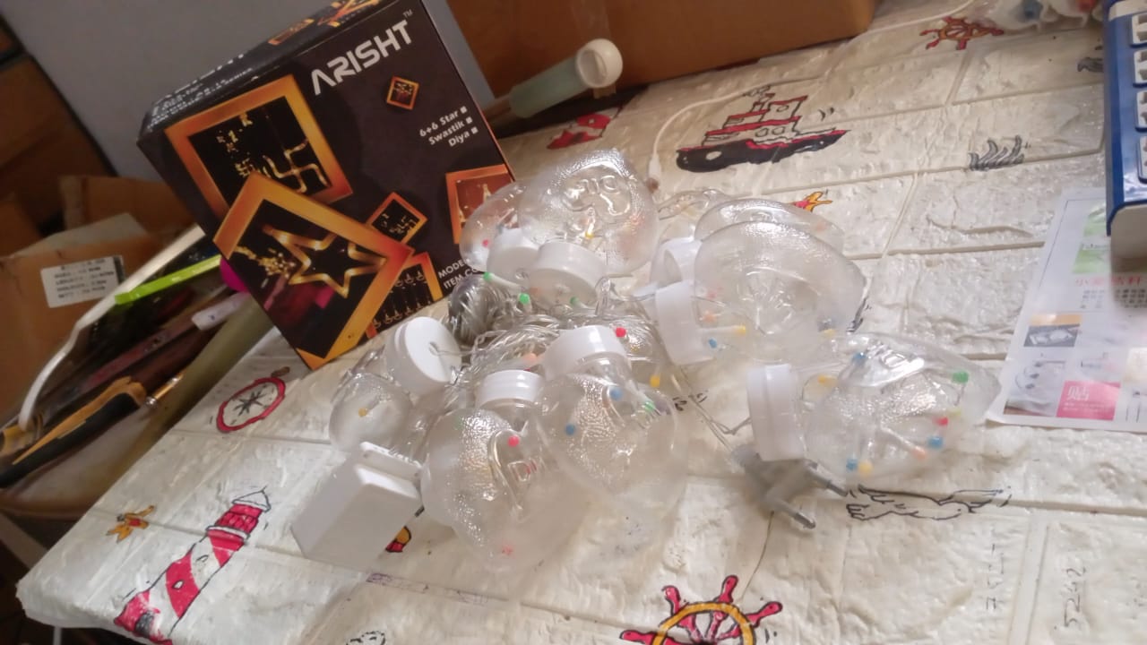 Wish Ball LED string lights glowing in the dark, perfect for festival lighting.