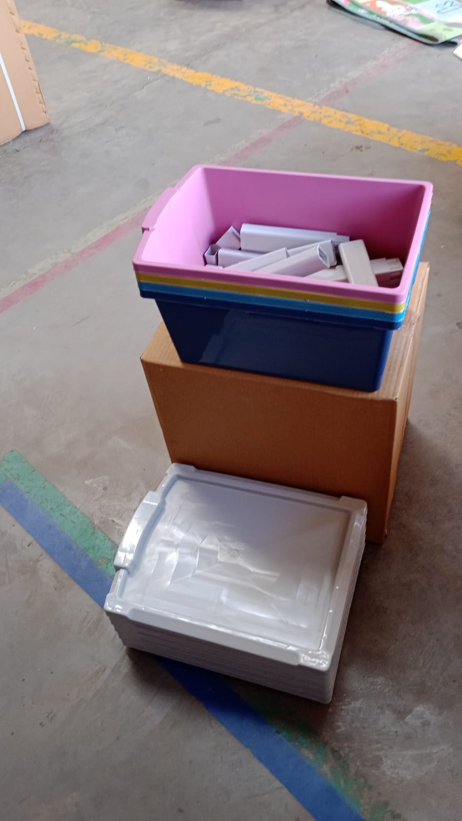 An empty plastic drawer storage unit on a white background, showcasing its clean design.