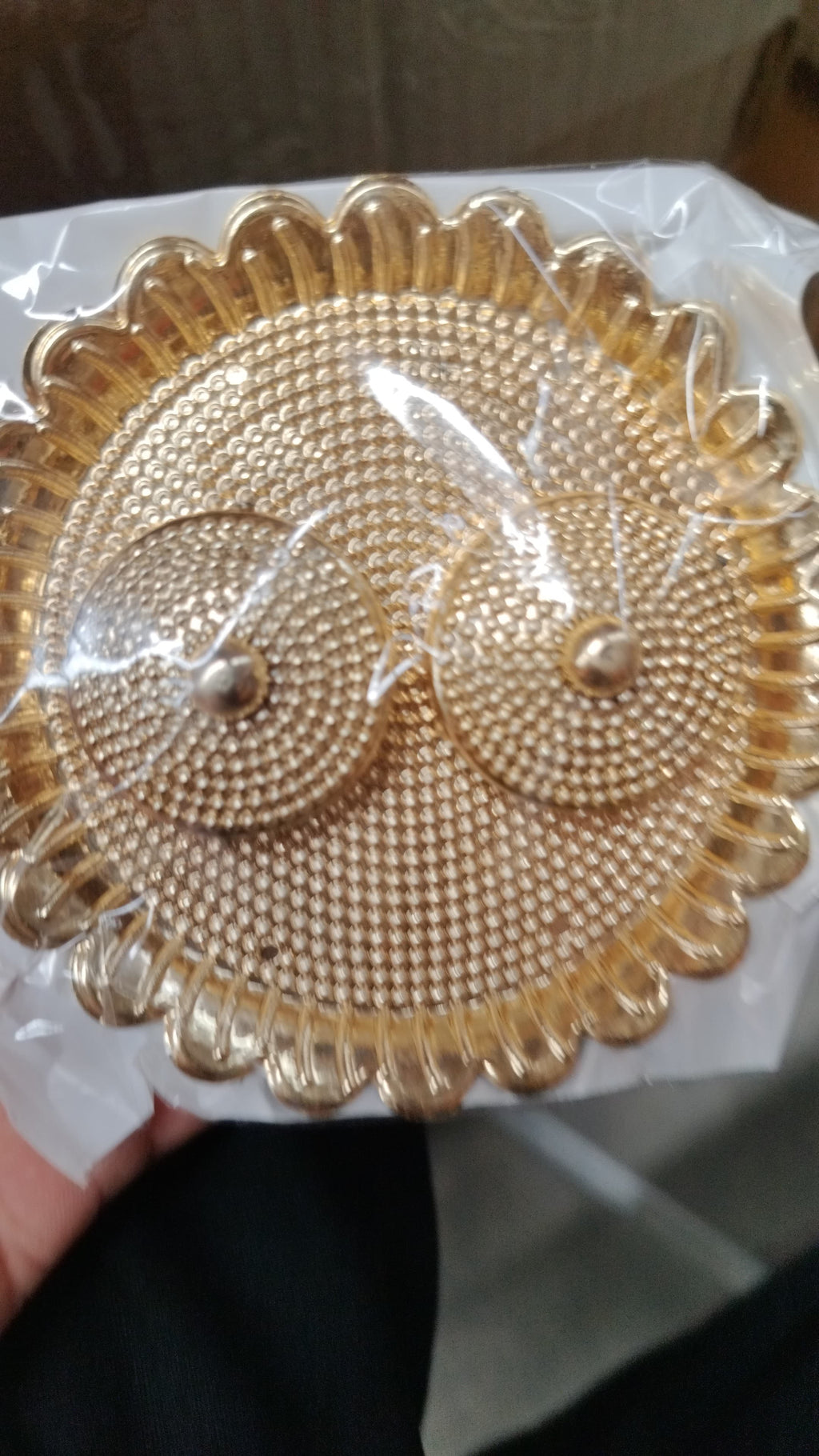 Traditional round Puja Thali presented as a thoughtful gift for special occasions.