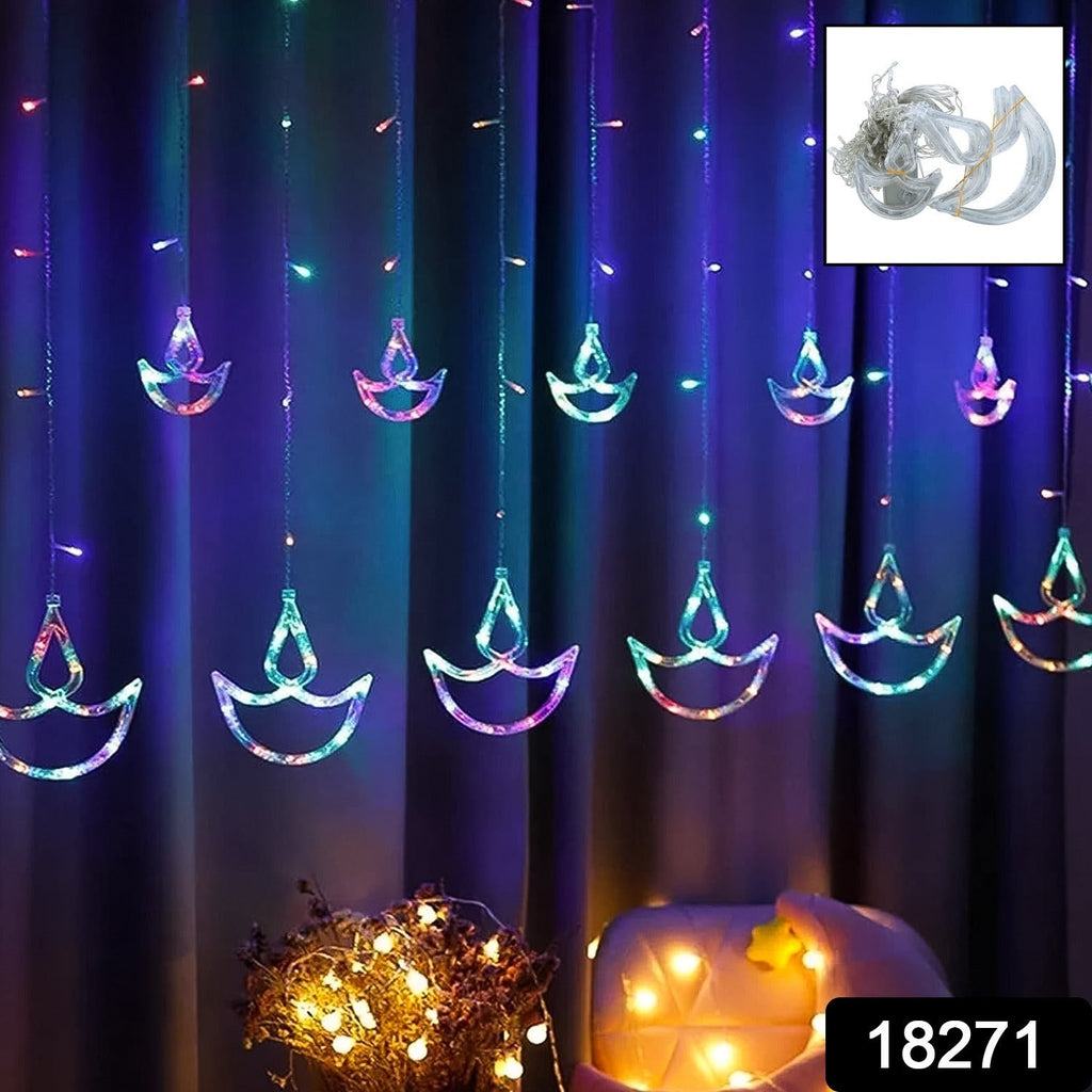 Close-up of LED Diya Curtain String Lights glowing warmly.