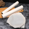 Non-stick baking paper roll displayed in a modern kitchen setting.