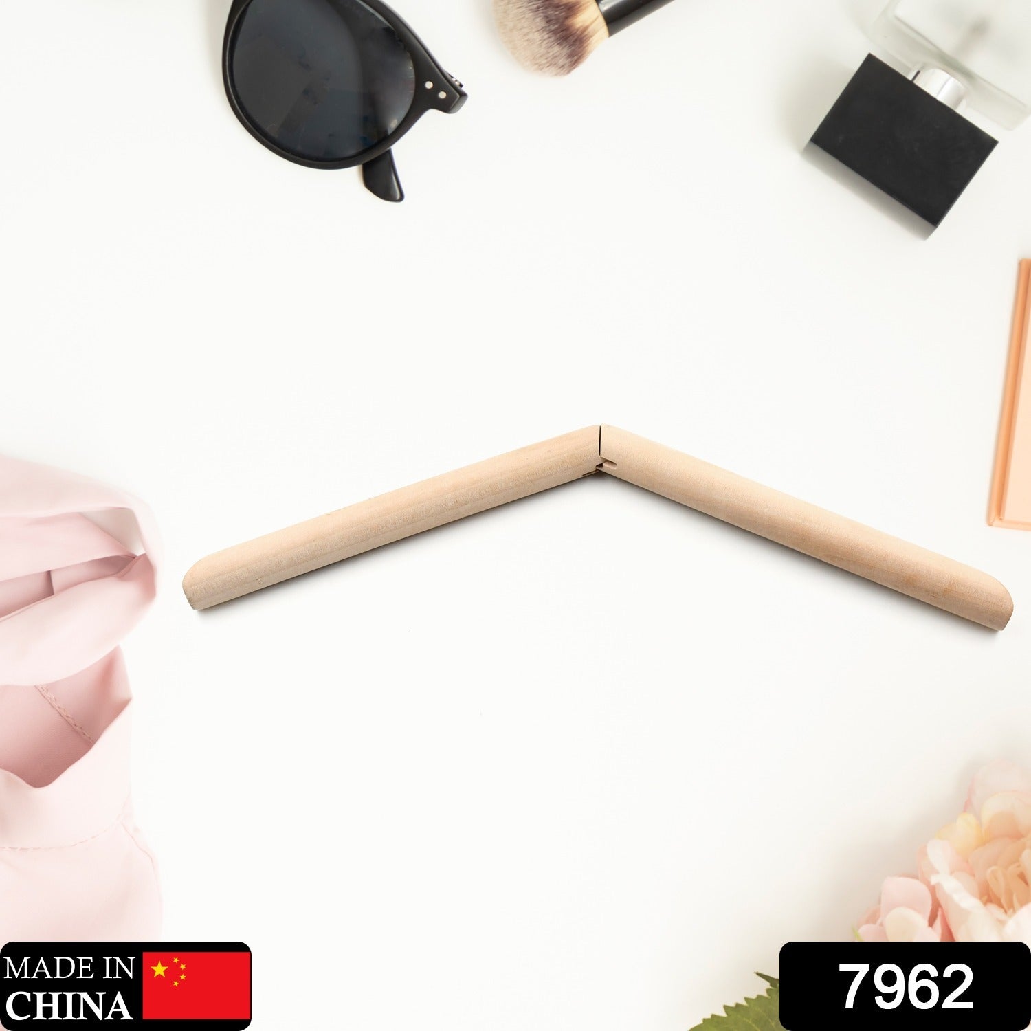 Set of elegant wooden coat hangers displayed neatly in a wardrobe.