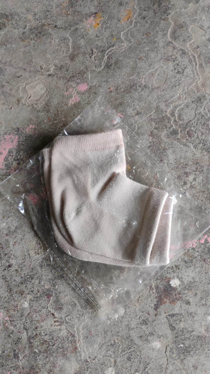 Instructional image showing how to wear the heel socks for best results.