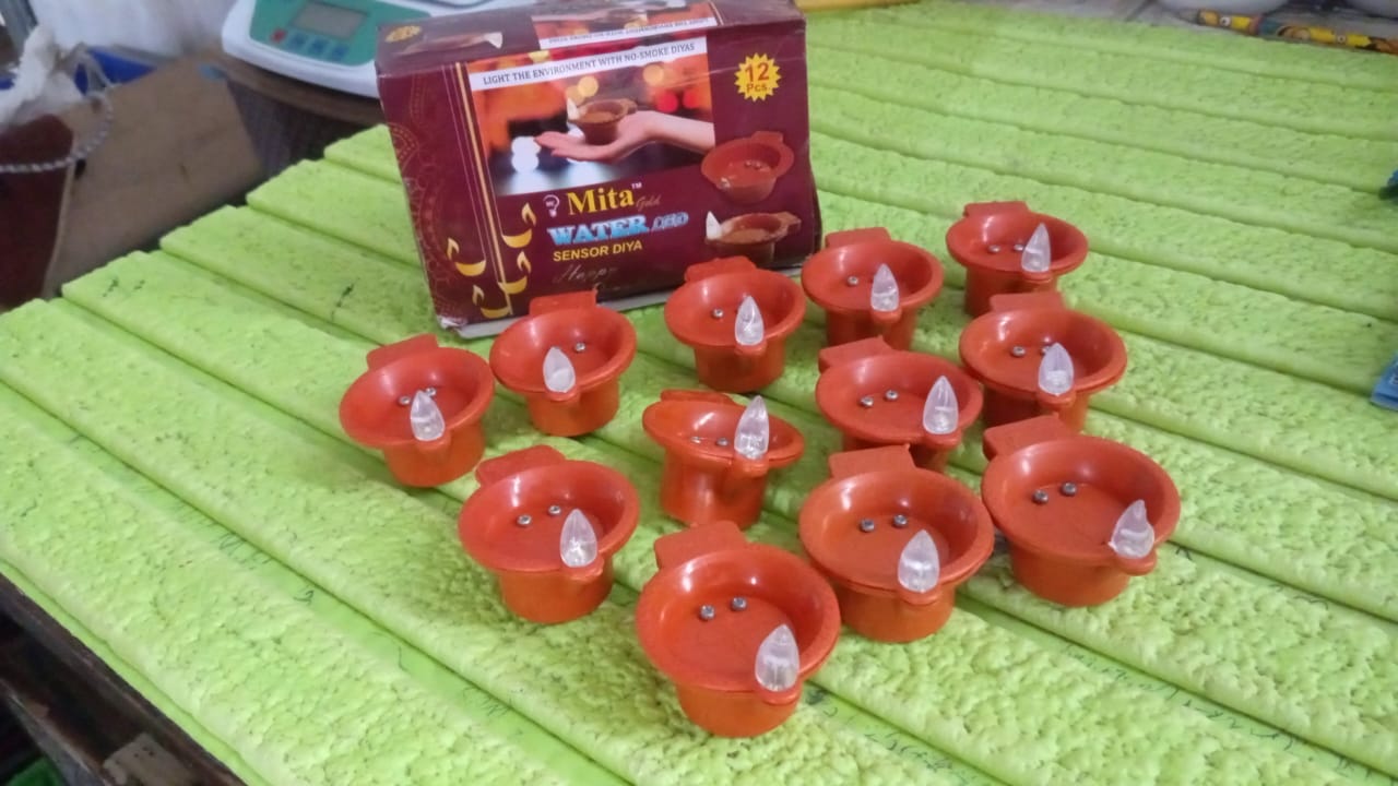 Packaging of the 12-piece water sensor diya set, ready for gifting.