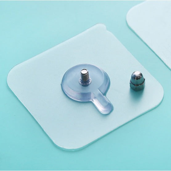 Adhesive screw wall hook securing a small item, showcasing its strong holding capability.