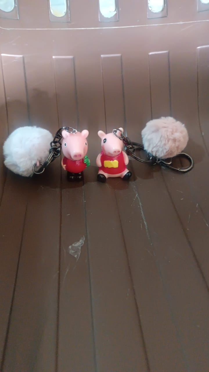 Mix design cartoon keychain featuring a fluffy pom pom accessory