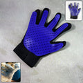 A five-finger pet deshedding glove with silicone tips, ready for grooming.