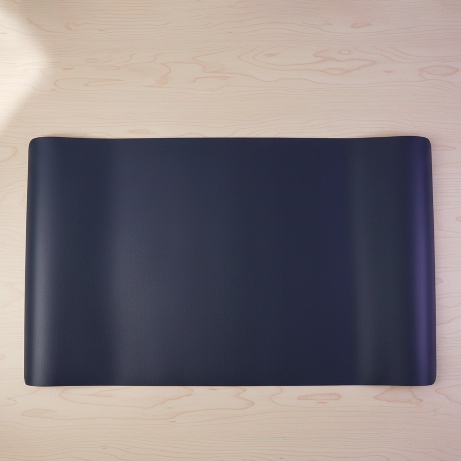 Workspace setup with large desk mat