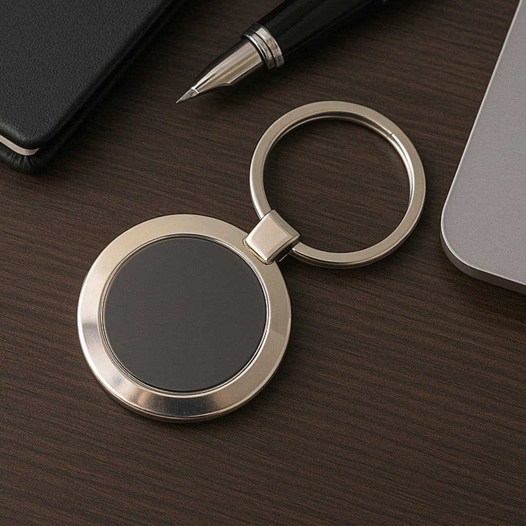 Durable round metal keychain with strong alloy build and black center.