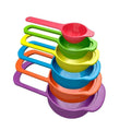 Set of 6 colorful plastic measuring spoons in various sizes, neatly arranged.