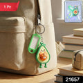 Close-up of cartoon character keychain charm with ID tag and metal key ring