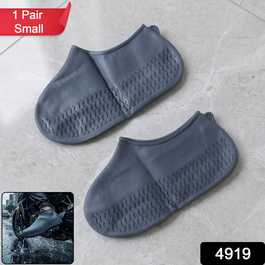 A pair of flexible, small silicone shoe covers displayed on a clean surface.