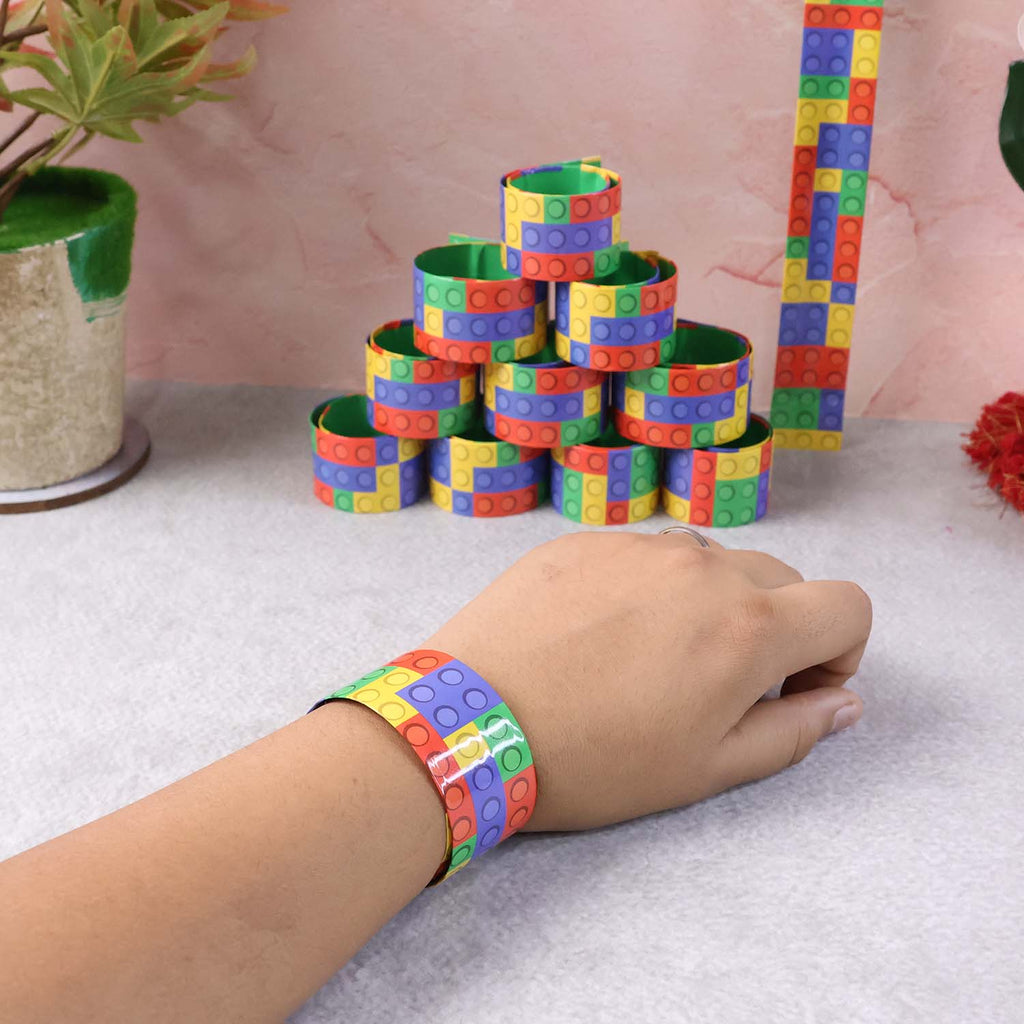 Various snap slap bracelets lined up with vibrant patterns